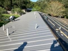 Standing seam metal roof installed by Ashby Holdings